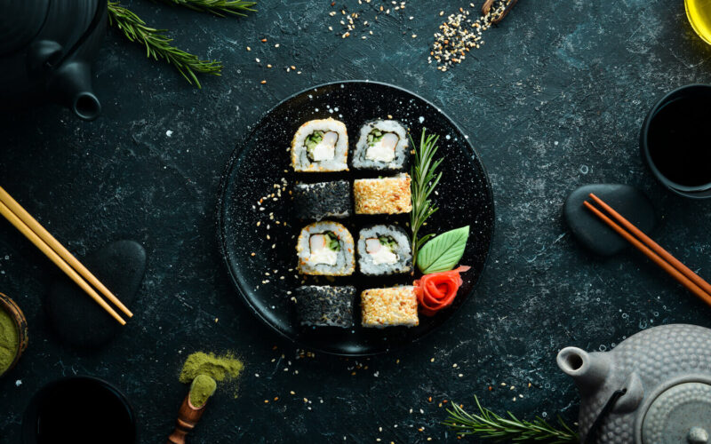 traditional-sushi-black-white-with-crab-cheese-herbs-japanese-cuisine-top-view-2